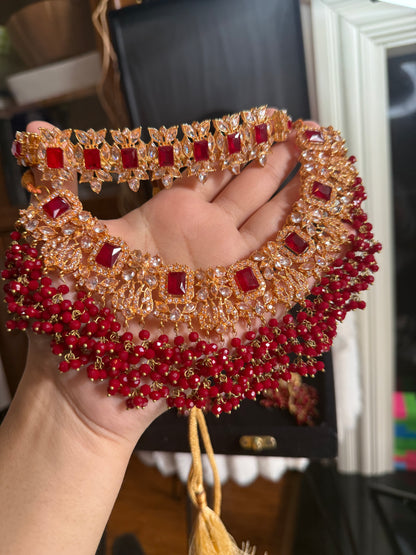 NIDA - Heavy bridal set includes: necklace, choker, jhumar, earrings, tikka and a hand piece (RED)