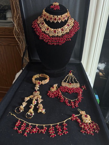 NIDA - Heavy bridal set includes: necklace, choker, jhumar, earrings, tikka and a hand piece (RED)
